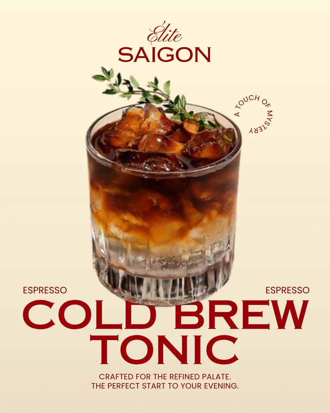 A rocks glass of cold brew coffee layered over milk and ice, finished with a sprig of thyme
